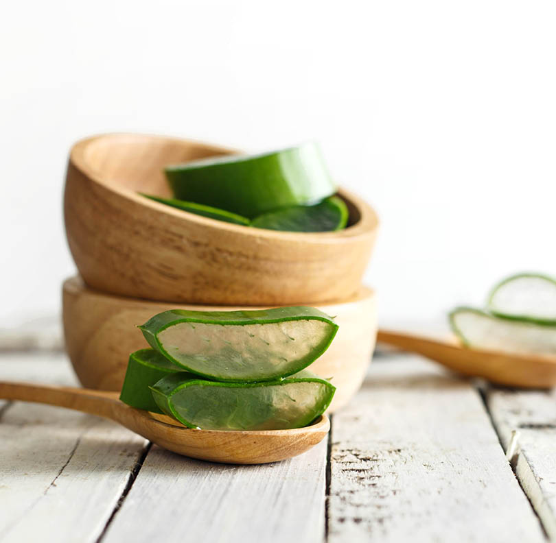 Fresh aloe vera on white wooden background